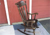 Large rocker finished in dark walnut.